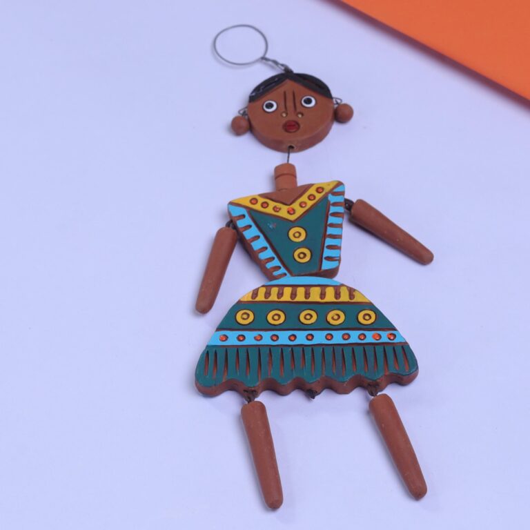 Handcrafted Terracotta Doll Girl Wall Hanging – A blend of innocence & tradition, beautifully crafted to brighten up your walls.