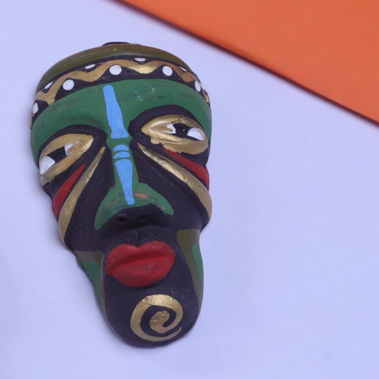 Handcrafted Terracotta Adivasi Face Wall Hanging – A stunning piece of tribal art that brings heritage and rustic charm to your walls.
